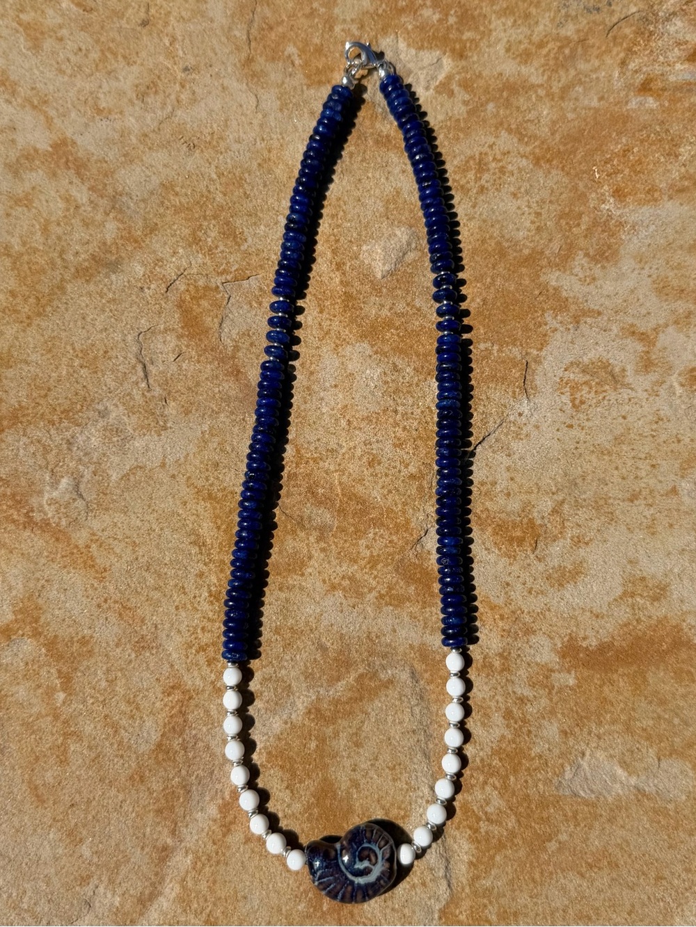 Hand-Strung Blue Lapis & White Natural Shell Necklace with Ceramic Shell Charm. - Picture 3 of 4